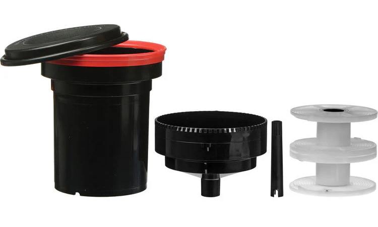 This photo displays a Paterson film developing tank and other darkroom items to show the viewer of this website that Brantford Film Lab is the best place to shop for film photographers in Brantford and Ontario Canada.